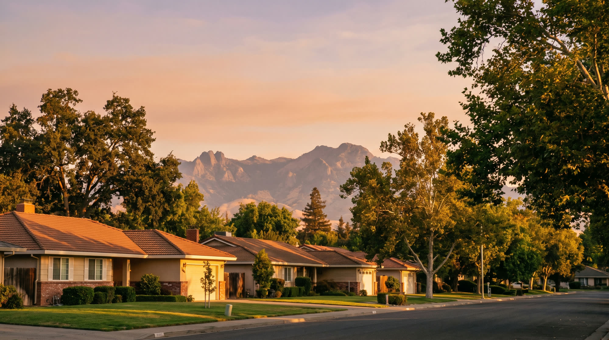 A quiet Yuba City neighborhood at golden hour with the Sutter Buttes rising in the distance